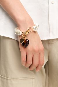Elastic bracelet with pearls and amber resin heart