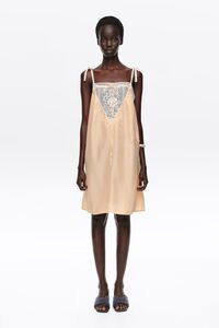 Short orange silk strappy dress
