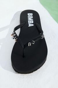 Black flip-flop with piercings