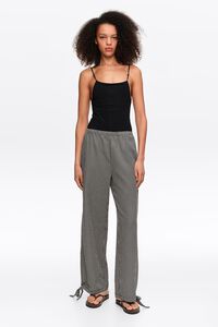Pantal&oacute;n tobillos ajustables cuadros negro