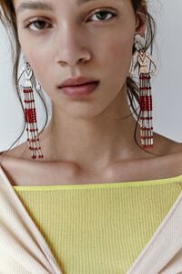 Aged silver metal silhouette and stones earrings